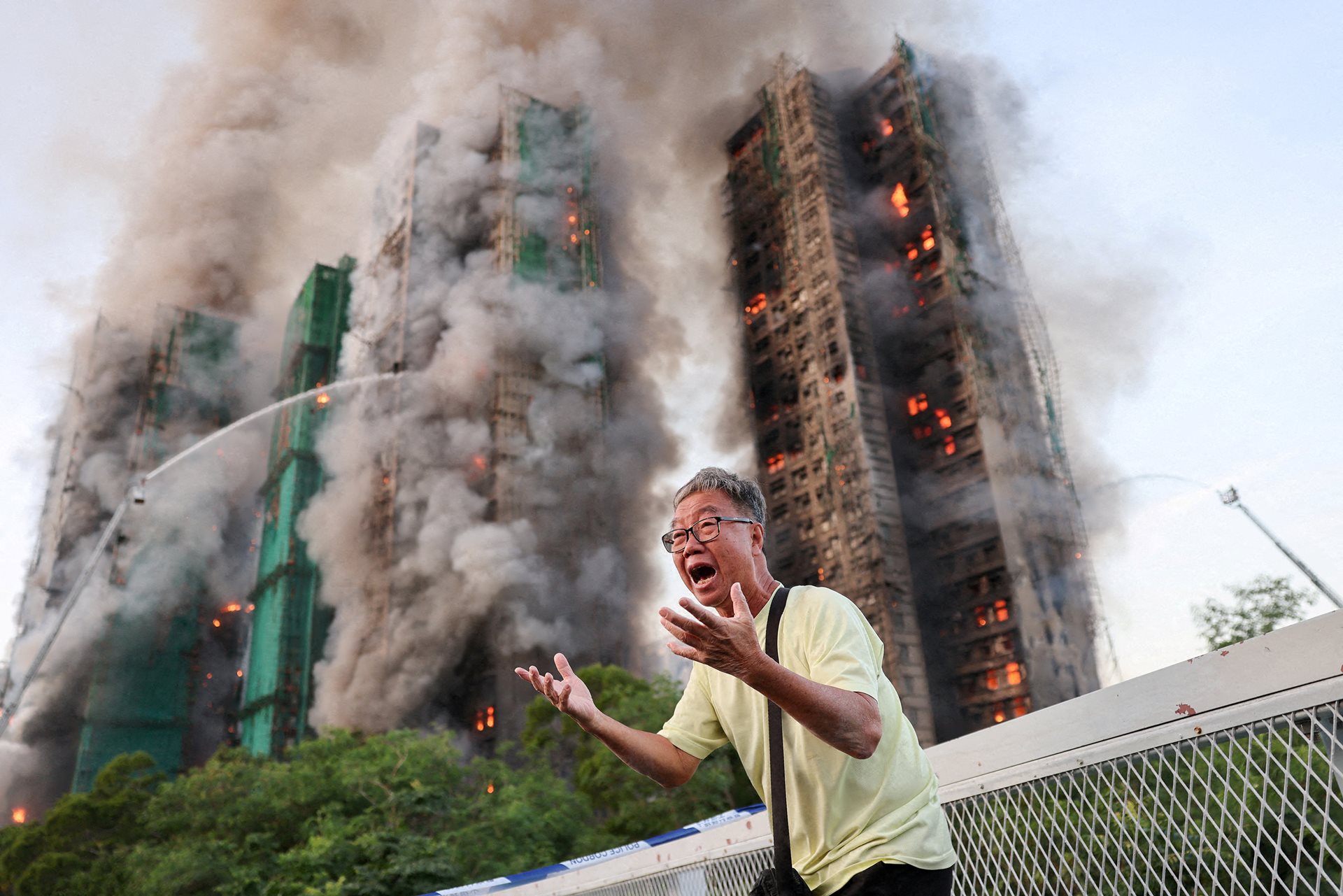 Mr Wong cries out in anguish as fire engulfs the Tai Po housing complex in Hong Kong that he calls home. Moments earlier, he exchanged final words over the phone with his wife, who was among the 168 victims trapped inside.