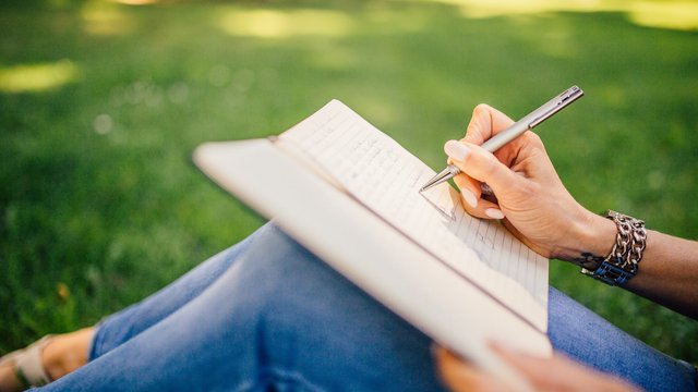 writing in a notebook